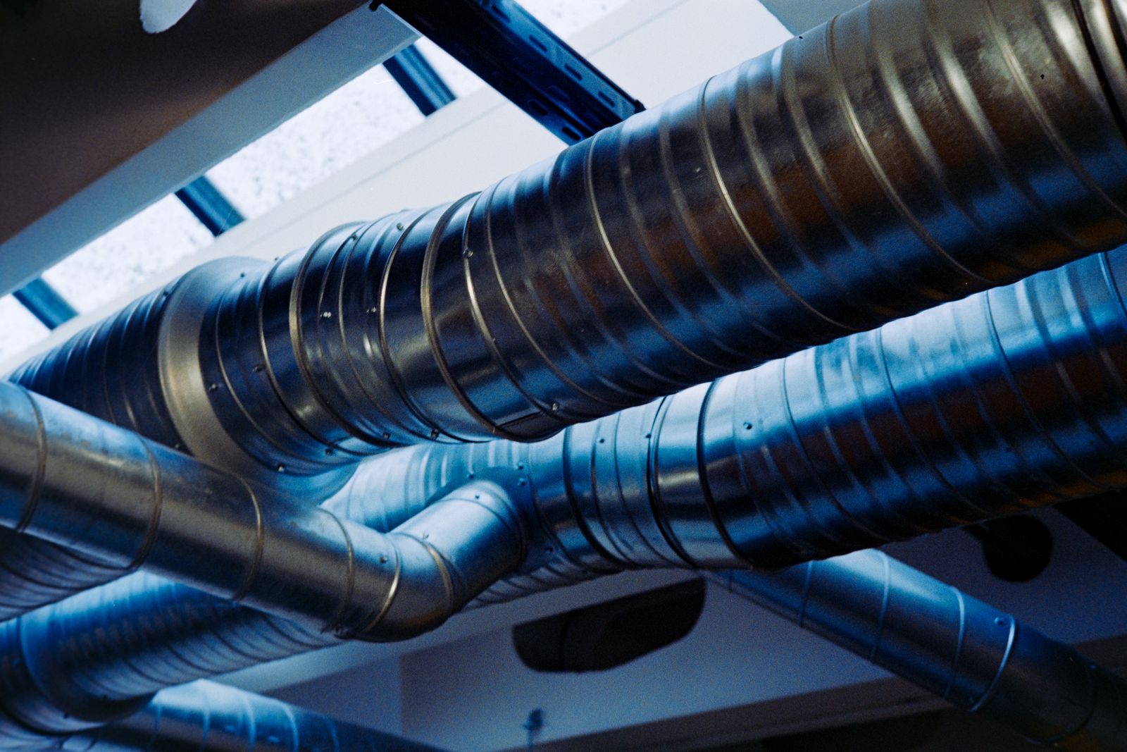 TAB services — modern commercial ductwork ventilation system in a metropolitan building